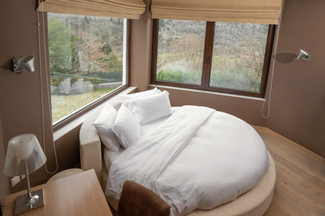 karpenisi-forest-suites-honeymoon-suite-bedroom-winter-garden-view